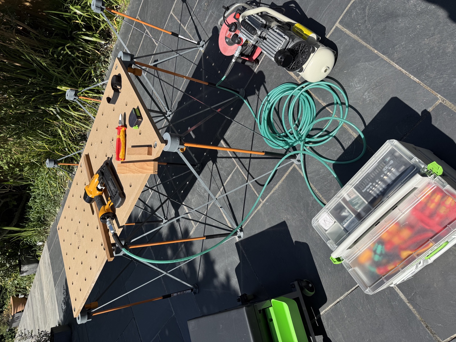 Mitre saw and dust extractor set up outdoors for cutting