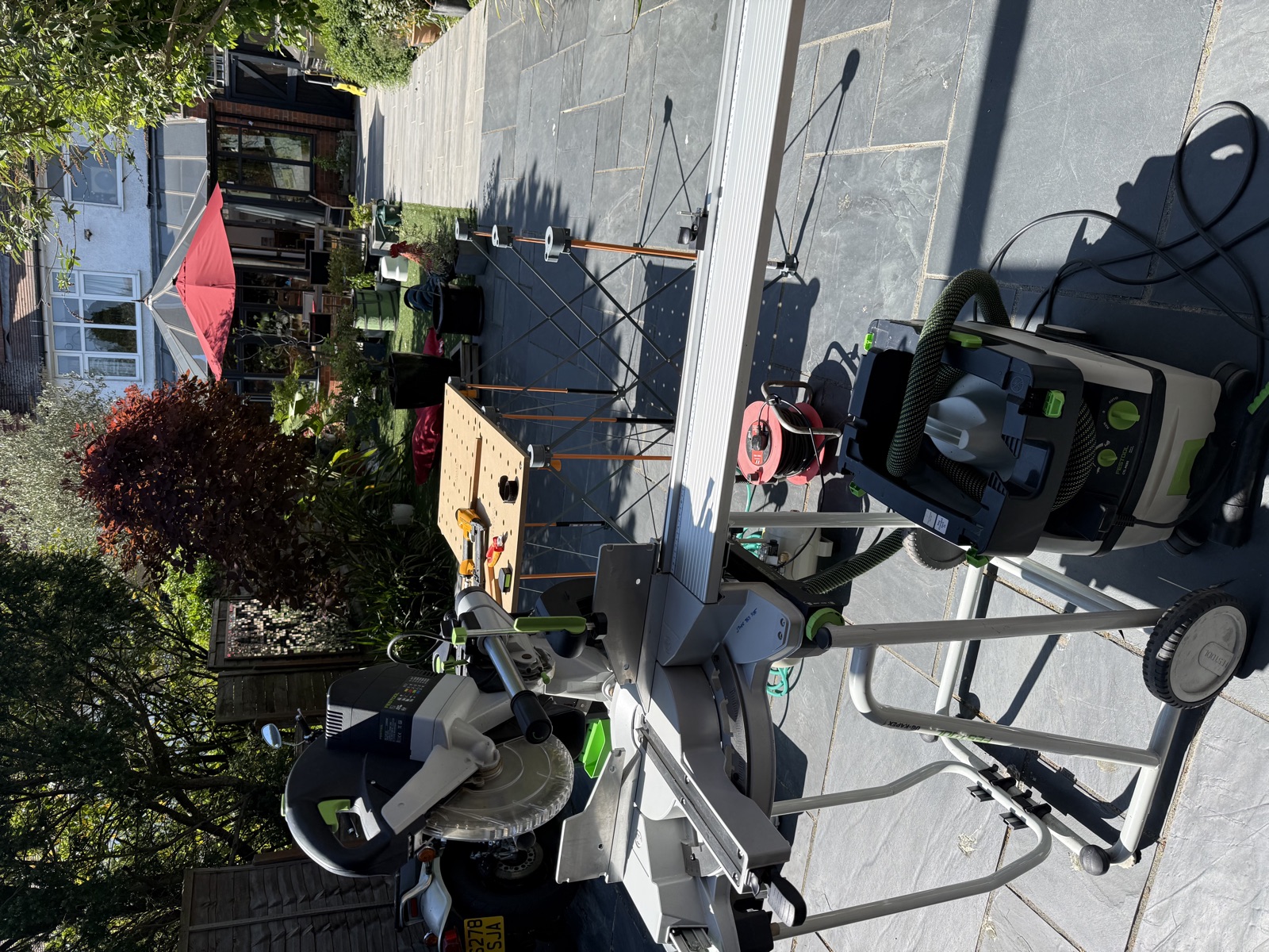 Overhead view of workshop with boards staged for cutting