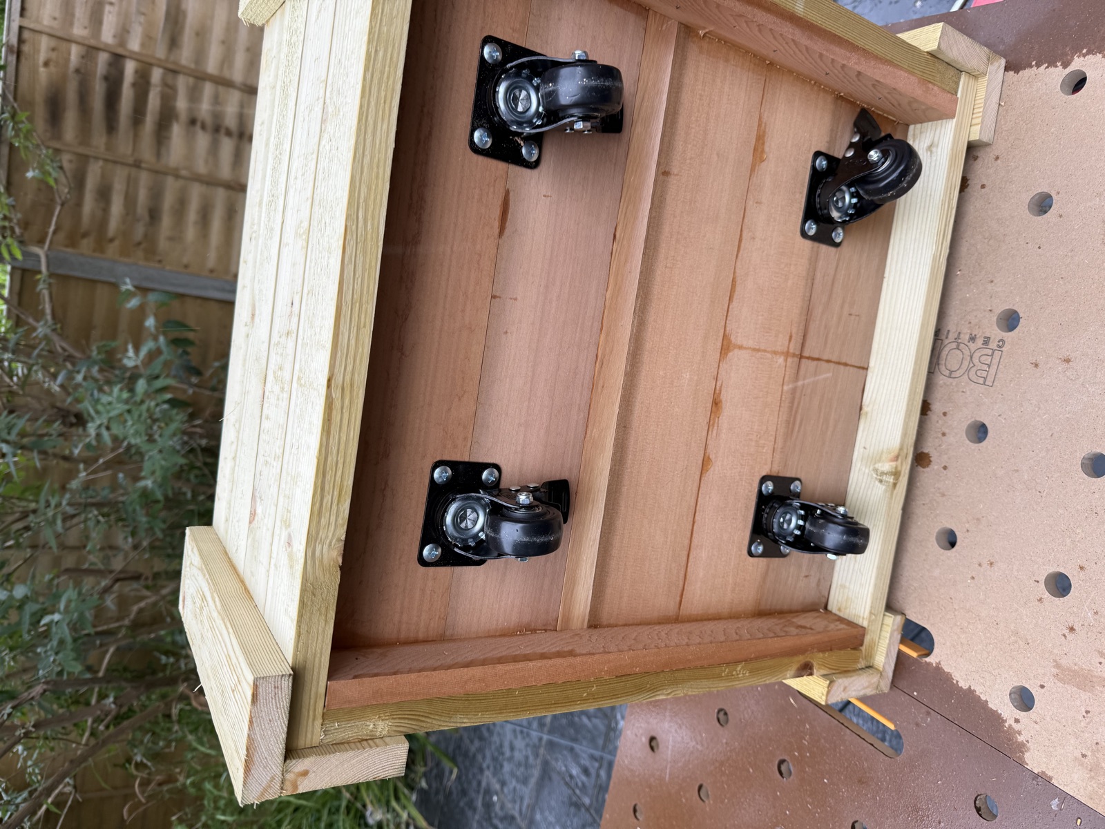 Cedar cladding underway — first rows on short side, 10 mm gaps visible