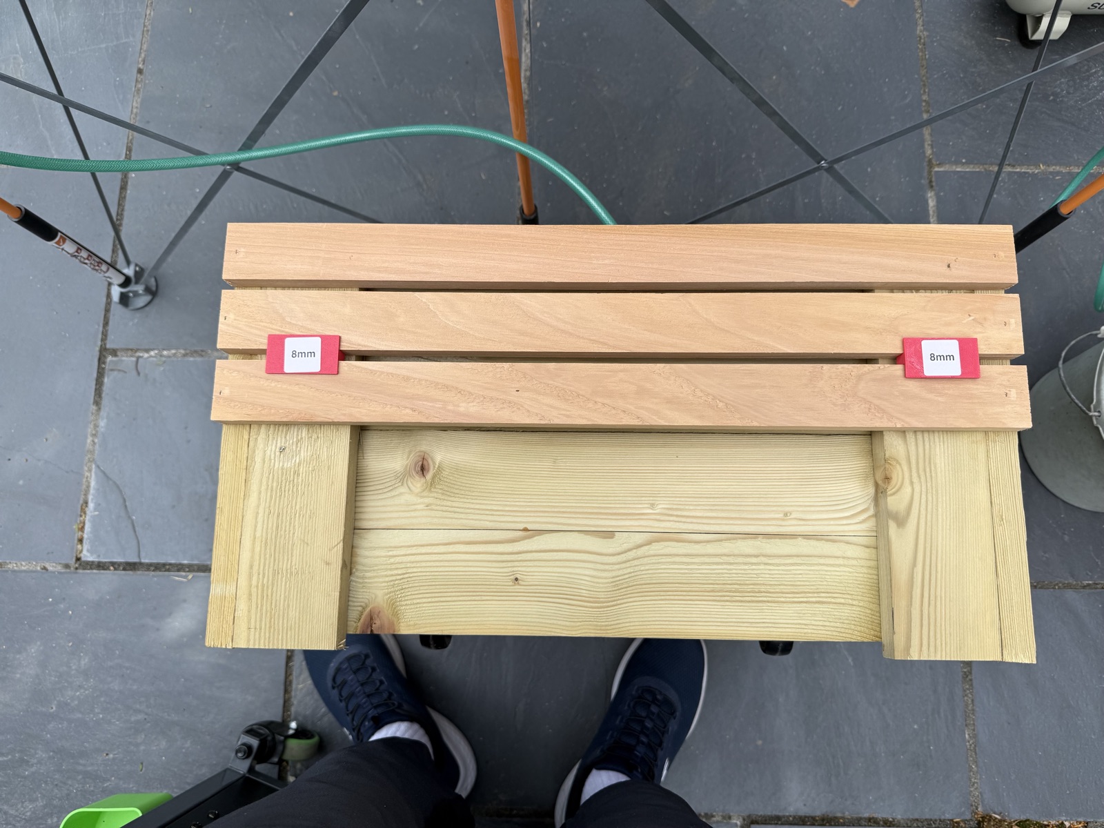Two sides clad in cedar with rows progressing downward