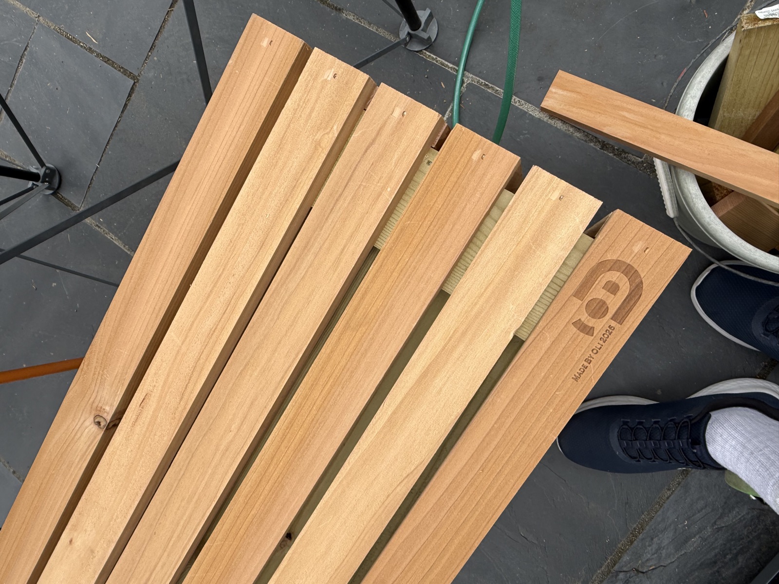 Cladding three-quarters complete, approaching bottom overhang row